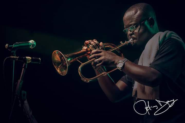 Biodun Batik playing Trumpet